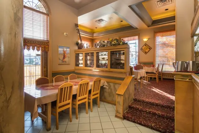 Private dining area with tables and warm lighting at Namskar