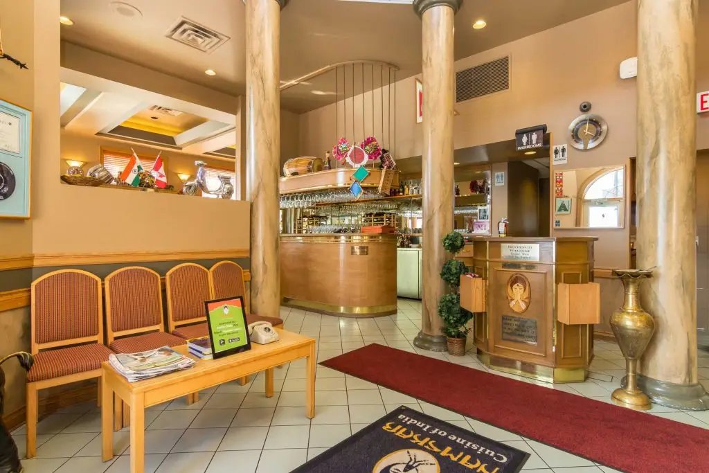 Waiting area, reception desk, and bar at Namskar